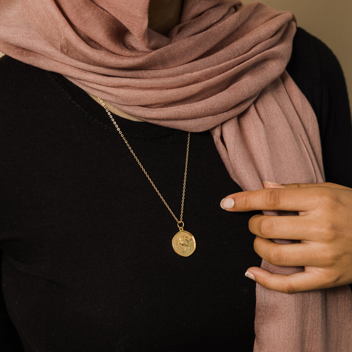 Close up of the June | Birth Flower Pendant as worn by the model.