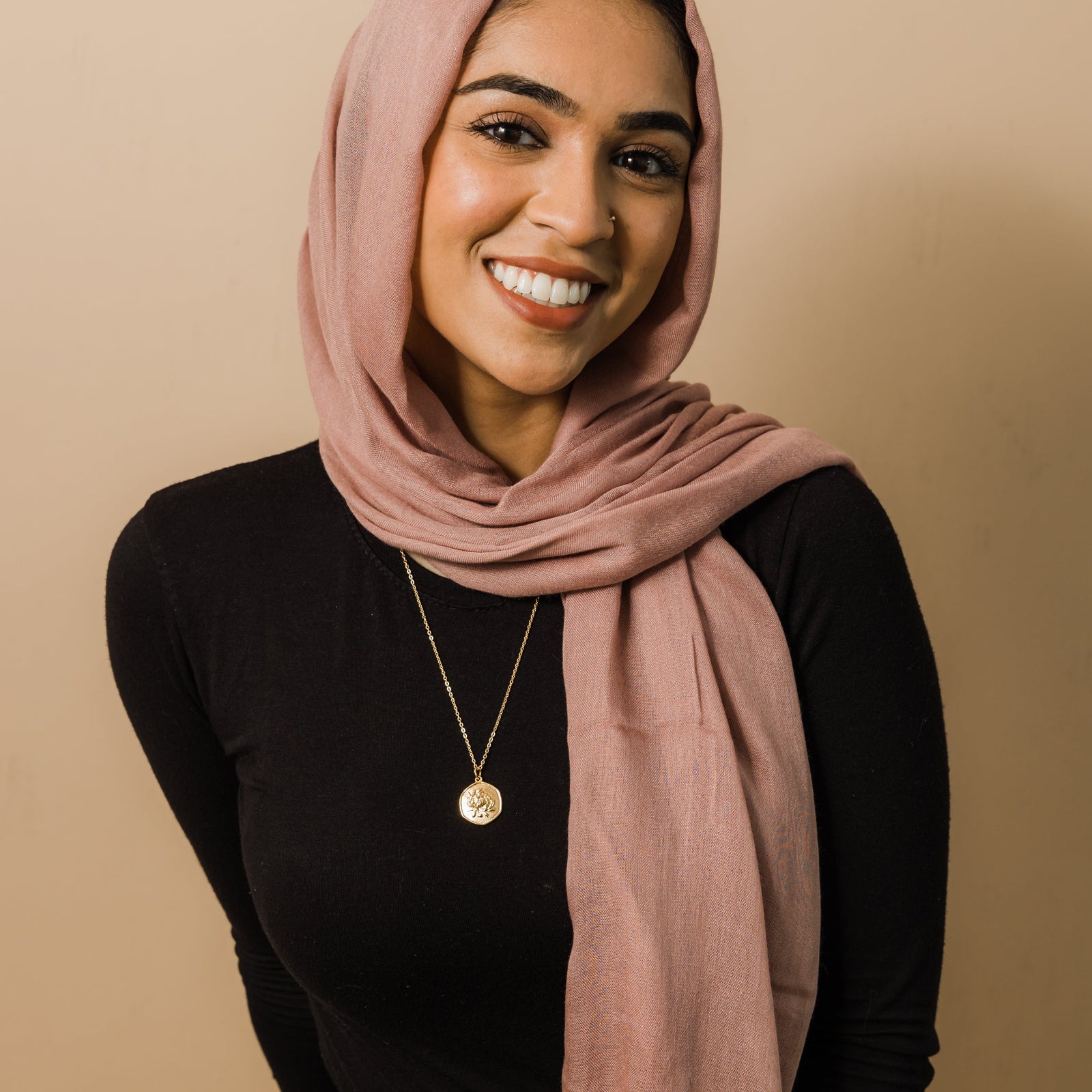 Photo of the model wearing the gold November | Birth Flower Pendant.