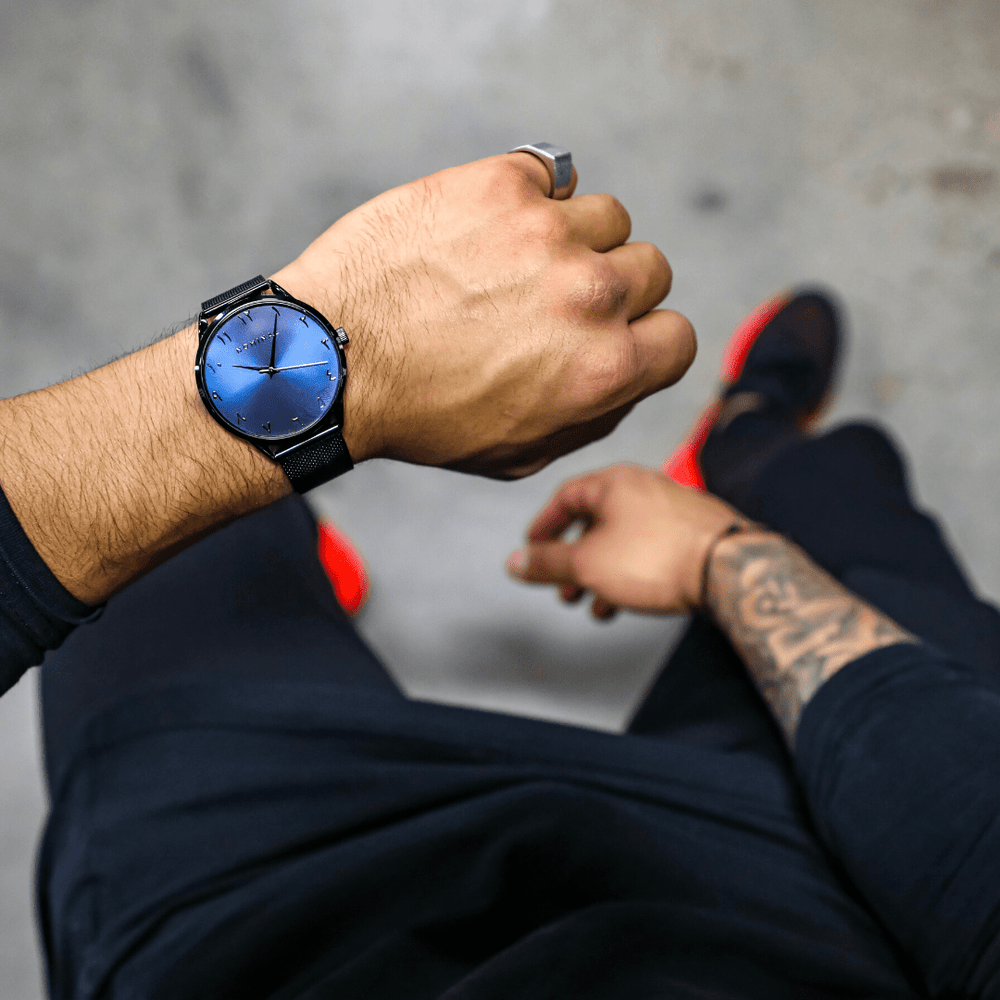 Photo of the model wearing the Dark Rain on their left wrist.