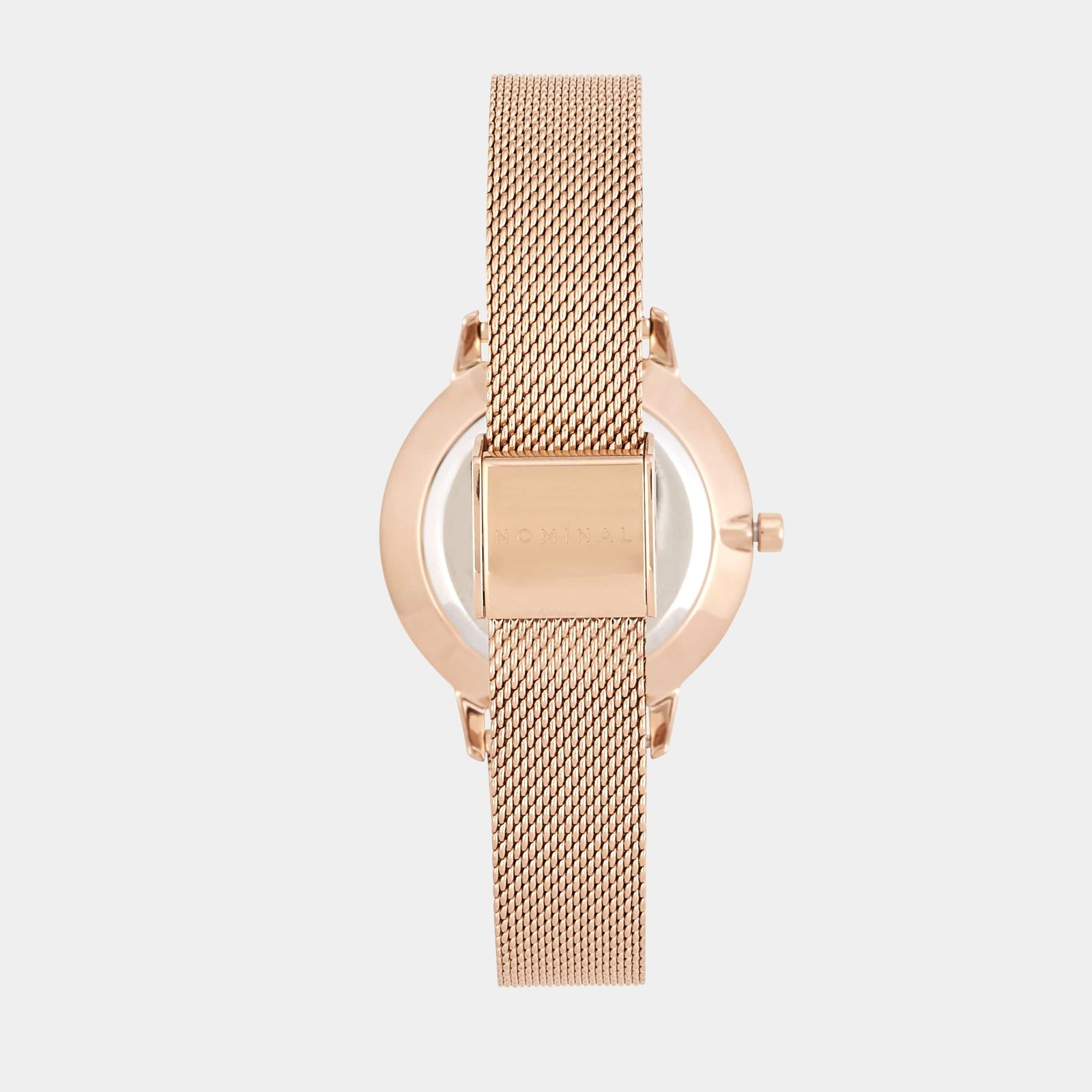 Back of a rose gold mesh strap watch, displaying a mesh strap and clasp with Nominal engraved on it displayed against a neutral background 
